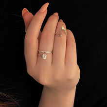 Load image into Gallery viewer, a women hand displaying, wearing the wave silver ring