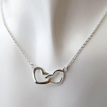将图片加载到图库查看器,a duo of two 925 silver hearts interlinked with each other , plain hearts suspended on dainty silver chain on white background