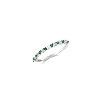thin emerald green and diamond ring each stone claw set on white gold on sterling silver. The ring is a half eternity ring on white background
