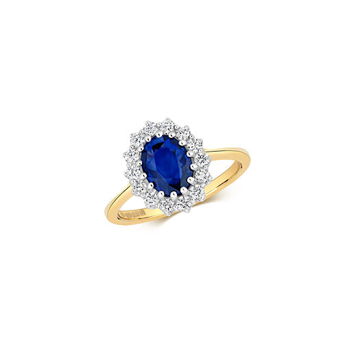 Blue Sapphire Diana Inspired Oval Cluster Ring Surrounded by Round Diamonds all claw set on a 9ct yellow gold band, white background